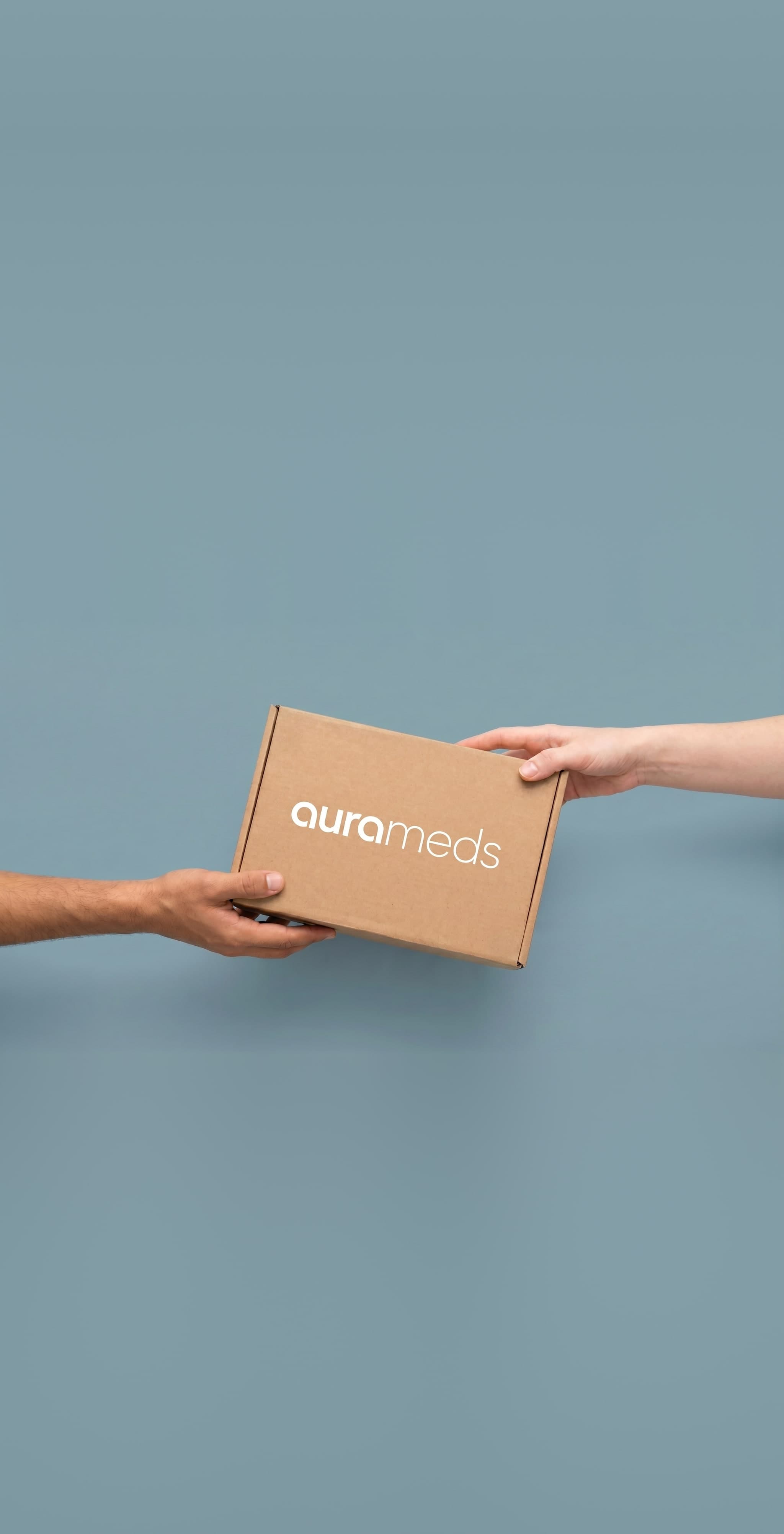 Two hands exchanging an Aura Meds delivery box